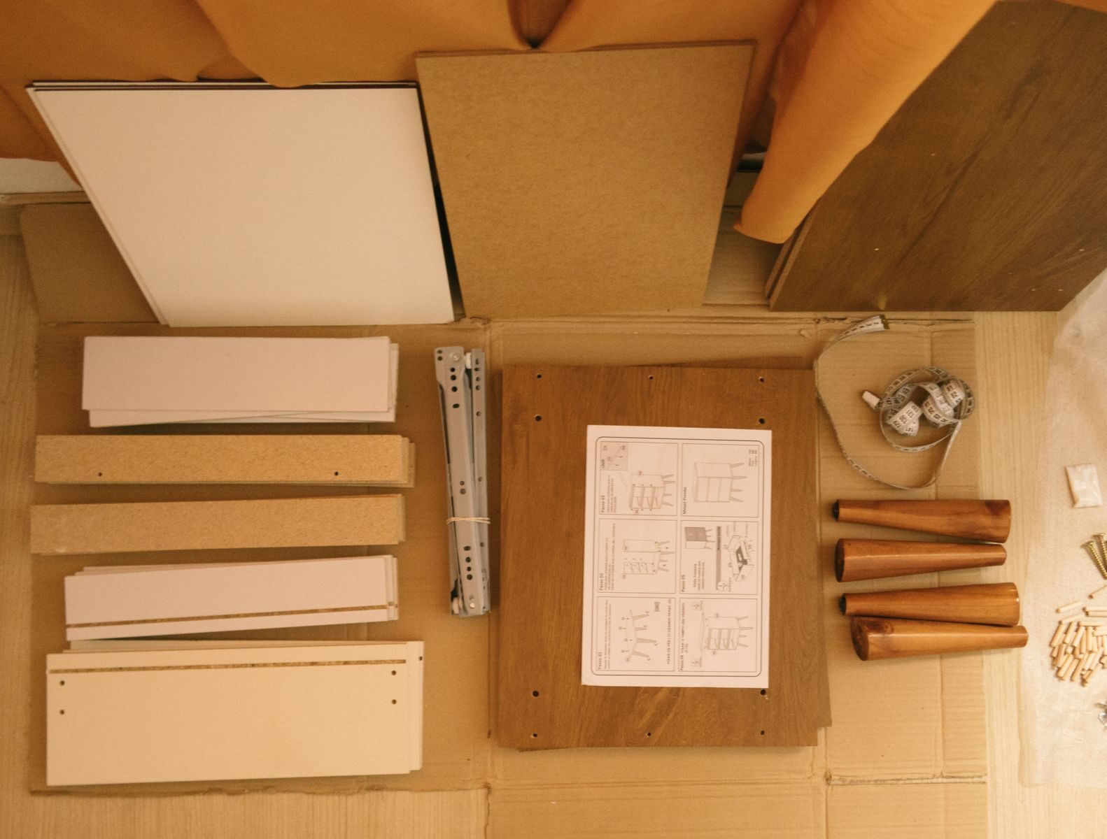 Flat-pack furniture parts laid out, showing the smooth pressed-wood panels that off-gas formaldehyde