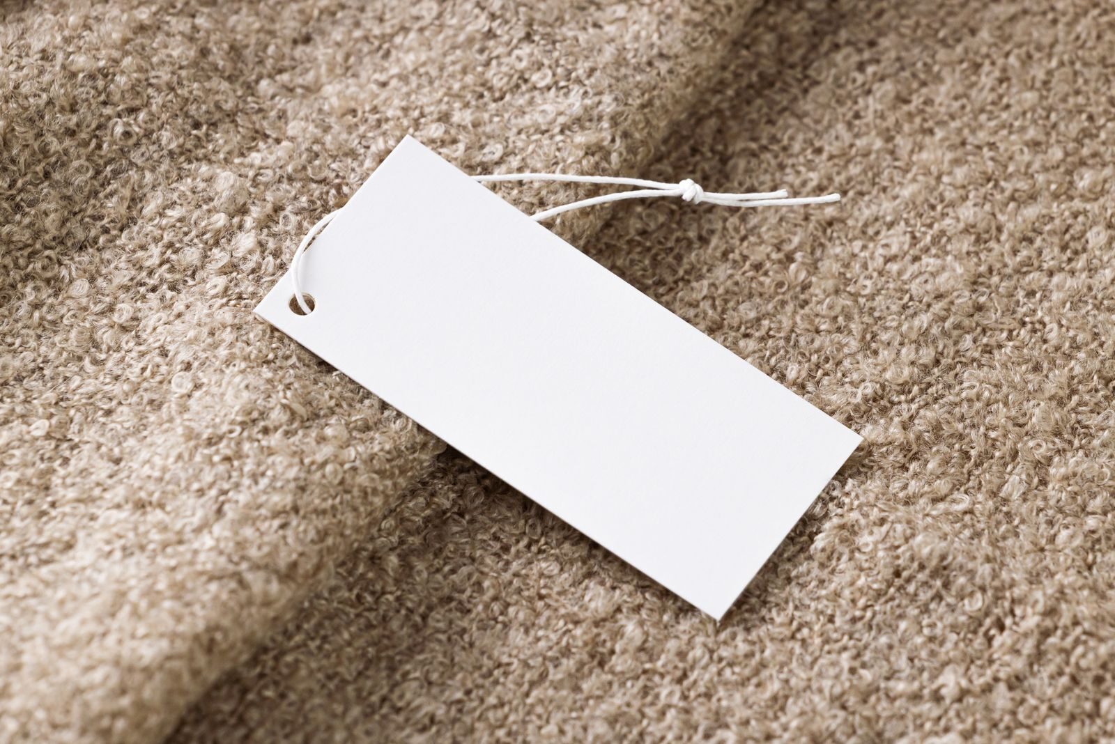 Blank tag attached to a carpet sample