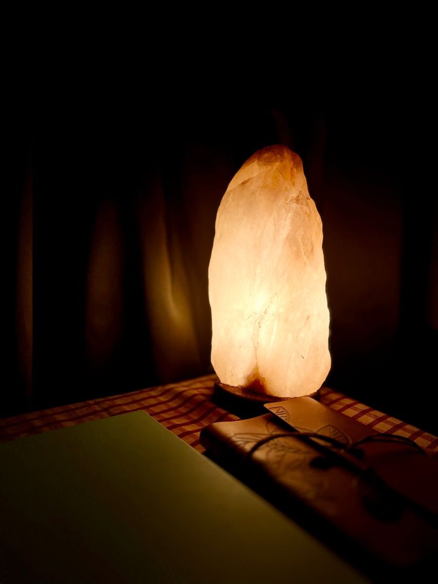 Himalayan salt lamp glowing in a dark room
