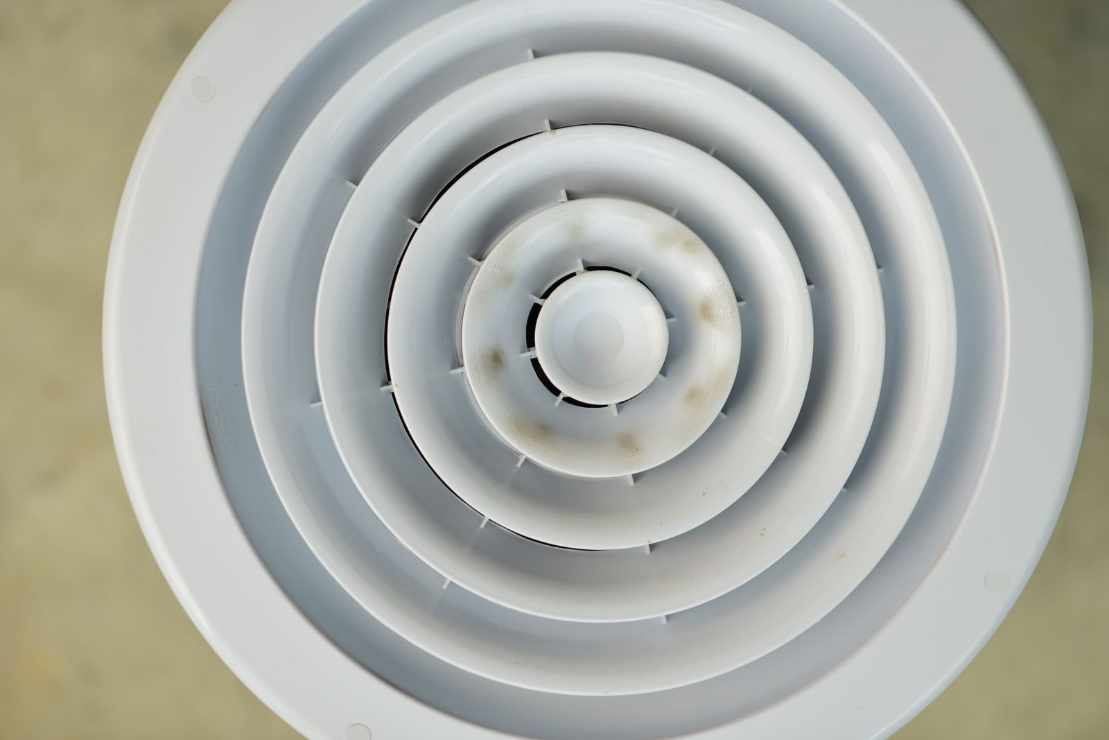 Round ceiling air diffuser, the kind a PIV unit pushes fresh air through into a home