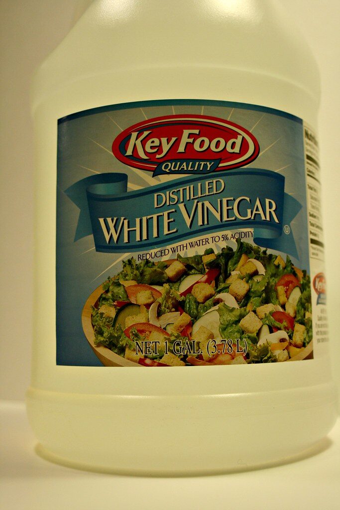 A jug of distilled white vinegar, the type used for cleaning and descaling
